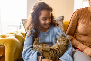 Slippy cat in little girls hands